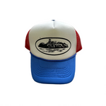Corteiz Alcatraz trucker hat in red, white, and blue design.