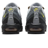 Rear view of Nike Air Max 95 Icons sneakers in gray and black with yellow accents.