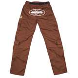 Corteiz Guerillaz Cargos in brown with multiple pockets and logo detailing.