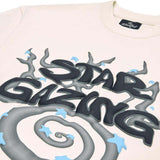 Broken Planet Star Gazing Vanilla White T-shirt with star gazing graphic in black and blue.