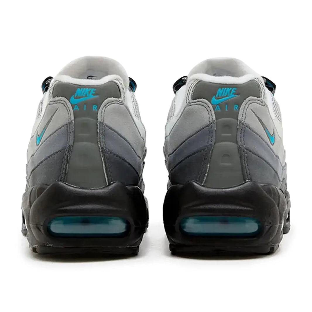 Nike Air Max 95 Baltic Blue sneakers with durable mesh and suede upper, featuring Air Max cushioning, shown in Iron Grey/Baltic Blue-Smoke Grey colorway, rear view.
