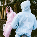 Pastel blue Five Questions Fleece zip-up hoodie with back star design worn outdoors