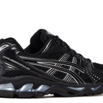 Black and silver Gel Kayano 14 running shoe with cushioning and mesh upper design