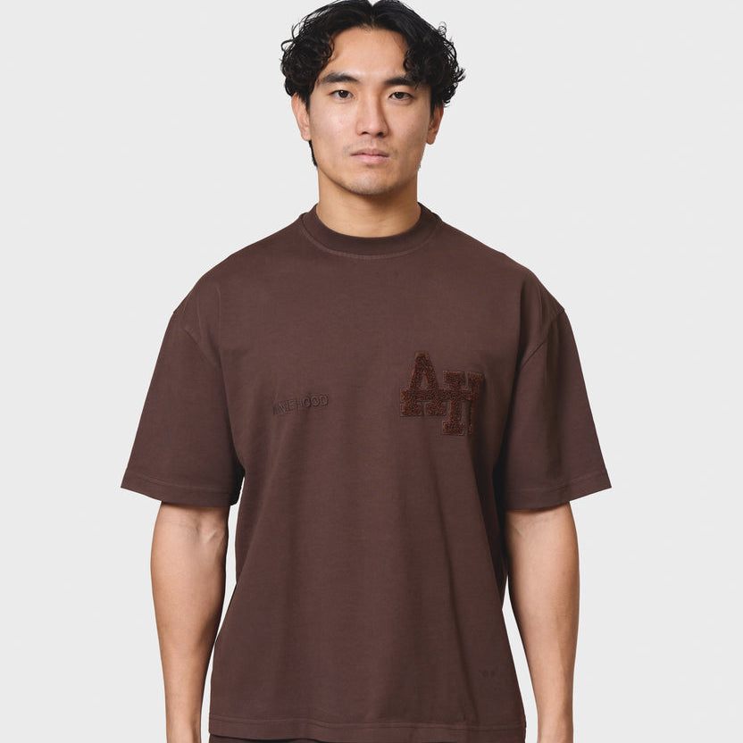 Annie Hood College T-shirt in washed brown, 280gsm cotton, relaxed fit modeled by a 6'0 person wearing size M