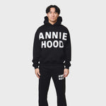Annie Hood Applique Hoody in black with relaxed fit, 500gsm brushback cotton, modeled by 6'0" figure wearing size M