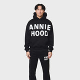 Annie Hood Applique Hoody in black with relaxed fit, 500gsm brushback cotton, modeled by 6'0" figure wearing size M