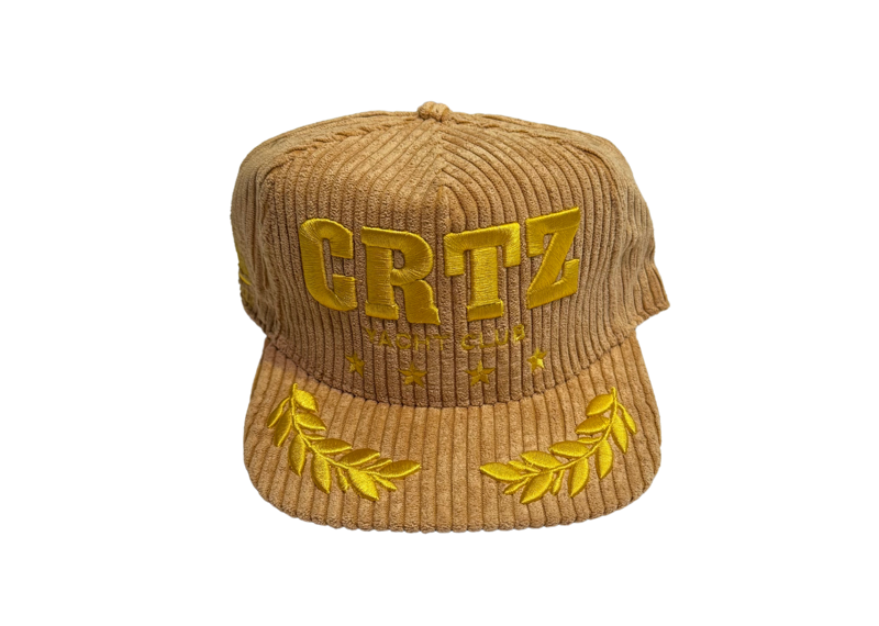 Corteiz Soho Yacht Club beige cap with embroidered design.