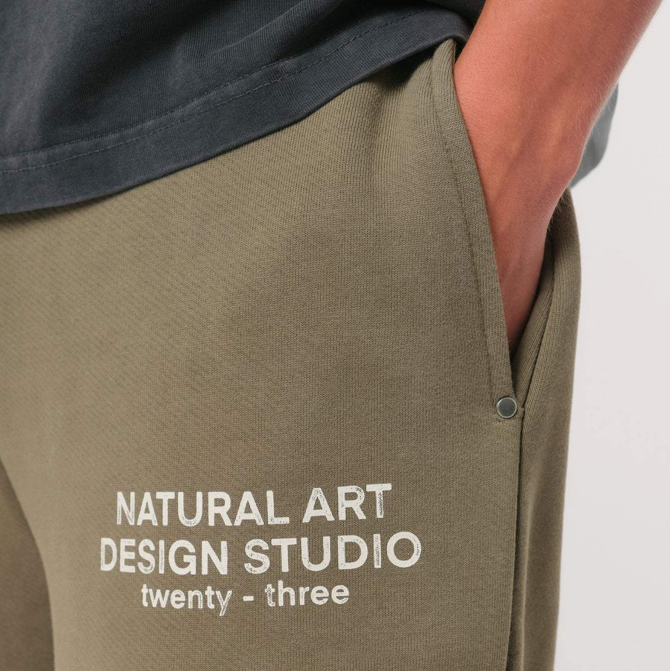 Natural Art Studio vintage wash green sweatpants with faded logo and metal rivets