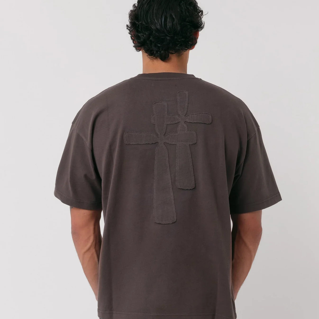 Natural Art Studio Classic Logo Tee with distressed appliqué monogram, boxy fit design.