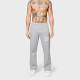 Grey ANNIE HOOD APPLIQUE JOGGERS in 500gsm brushback cotton with relaxed fit modeled by 6'0 male wearing size M