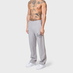 Annie Hood College joggers in washed grey, 500gsm brushback cotton with a relaxed fit, modeled by a 6'0" individual with a 31-inch waist.
