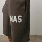 Brown Natural Art Studio NAS appliqué cotton shorts with elastic waistband and metal rivets on pockets