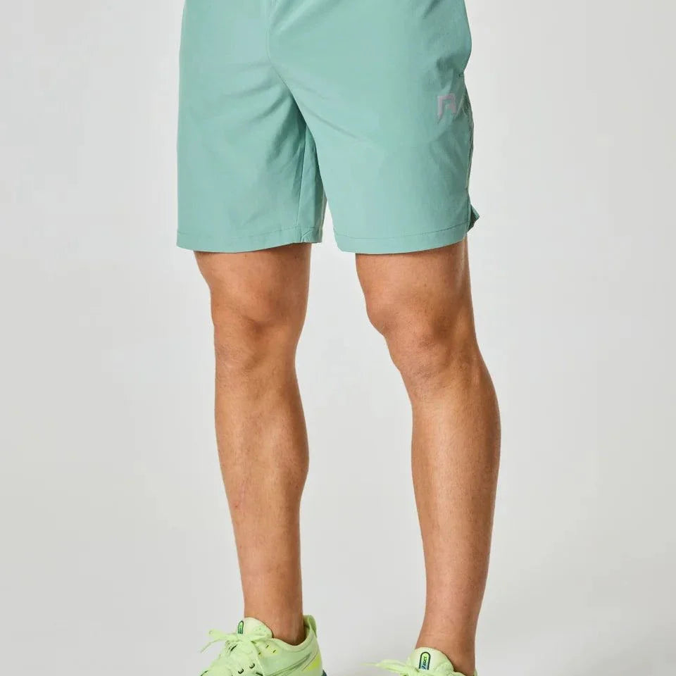Reprimo Pulse Shorts in Seafoam color worn by a person.