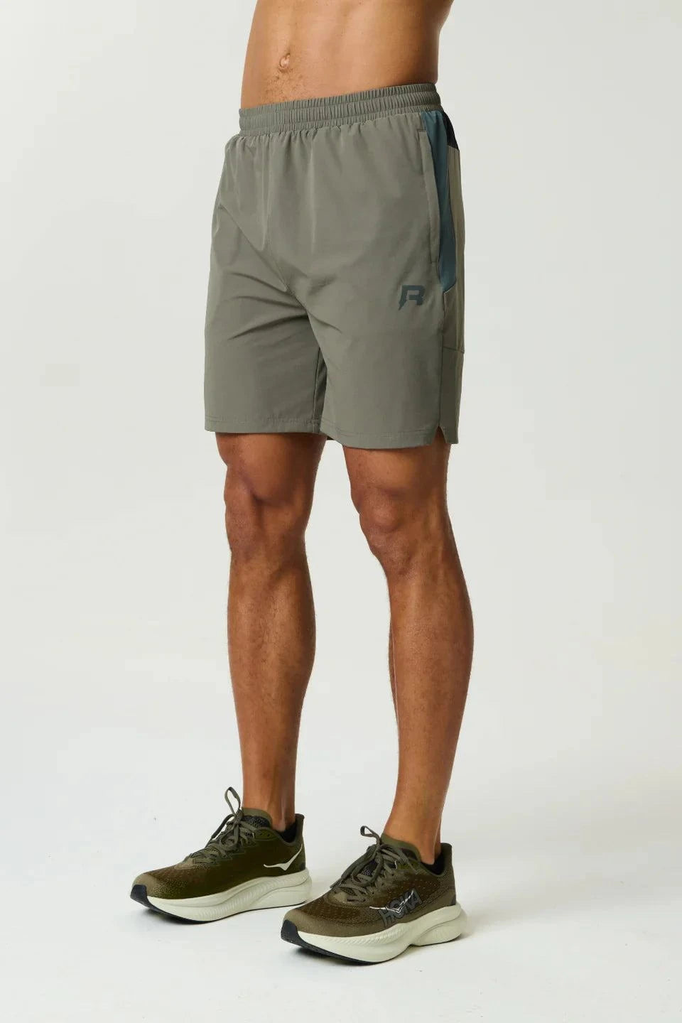 Reprimo Vortex Shorts in dark moss and grey velvet with ergonomic paneling and adjustable waistband for performance and style