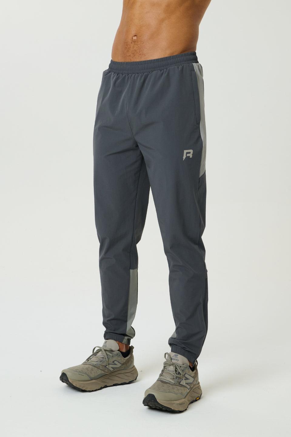 Reprimo Vortex Pants in faded dune and slate with ergonomic panels and adjustable waistband for flexible performance