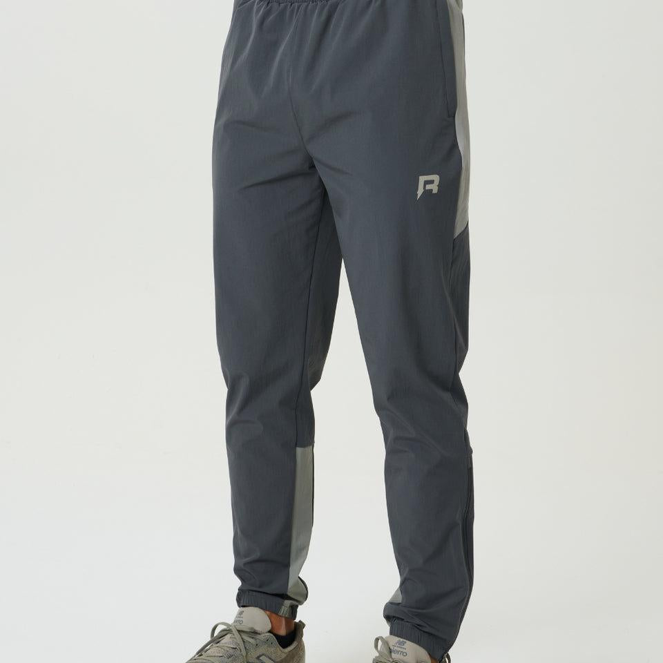 Reprimo Vortex Pants in faded dune and slate with ergonomic panels and adjustable waistband for flexible performance