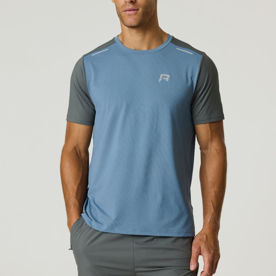 Men's Reprimo Flight T-Shirt in Air Force Blue and Gunmetal with athletic fit and reflective strips for visibility.