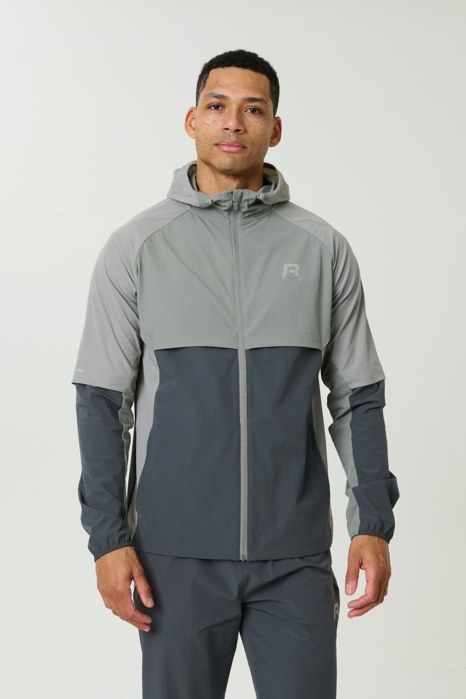 Reprimo Vortex Windbreaker in Faded Dune and Slate with ergonomic panels and reflective details