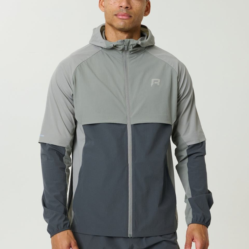 Reprimo Vortex Windbreaker in Faded Dune and Slate with ergonomic panels and reflective details
