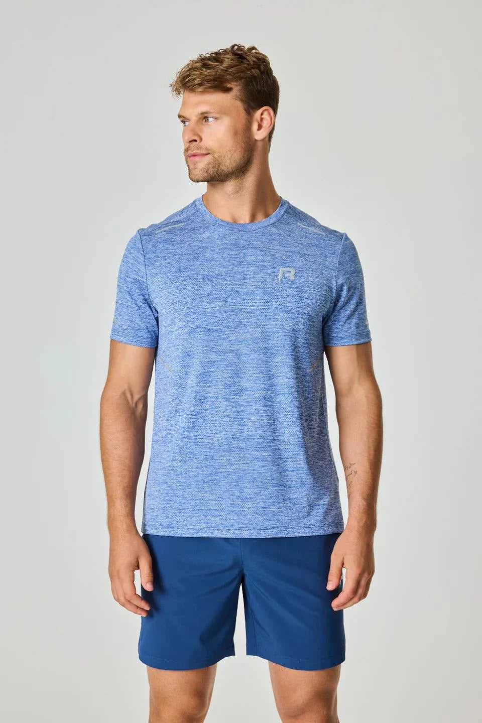 Reprimo Pulse T-Shirt - Indigo worn by a model.