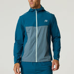 Men's Reprimo Flight Windbreaker in tidal teal and blue steel with zip pockets and hood, lightweight wind and rain resistant jacket.