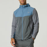 Man wearing Reprimo Flight Windbreaker in Air Force Blue and Gunmetal with hood and zip pockets