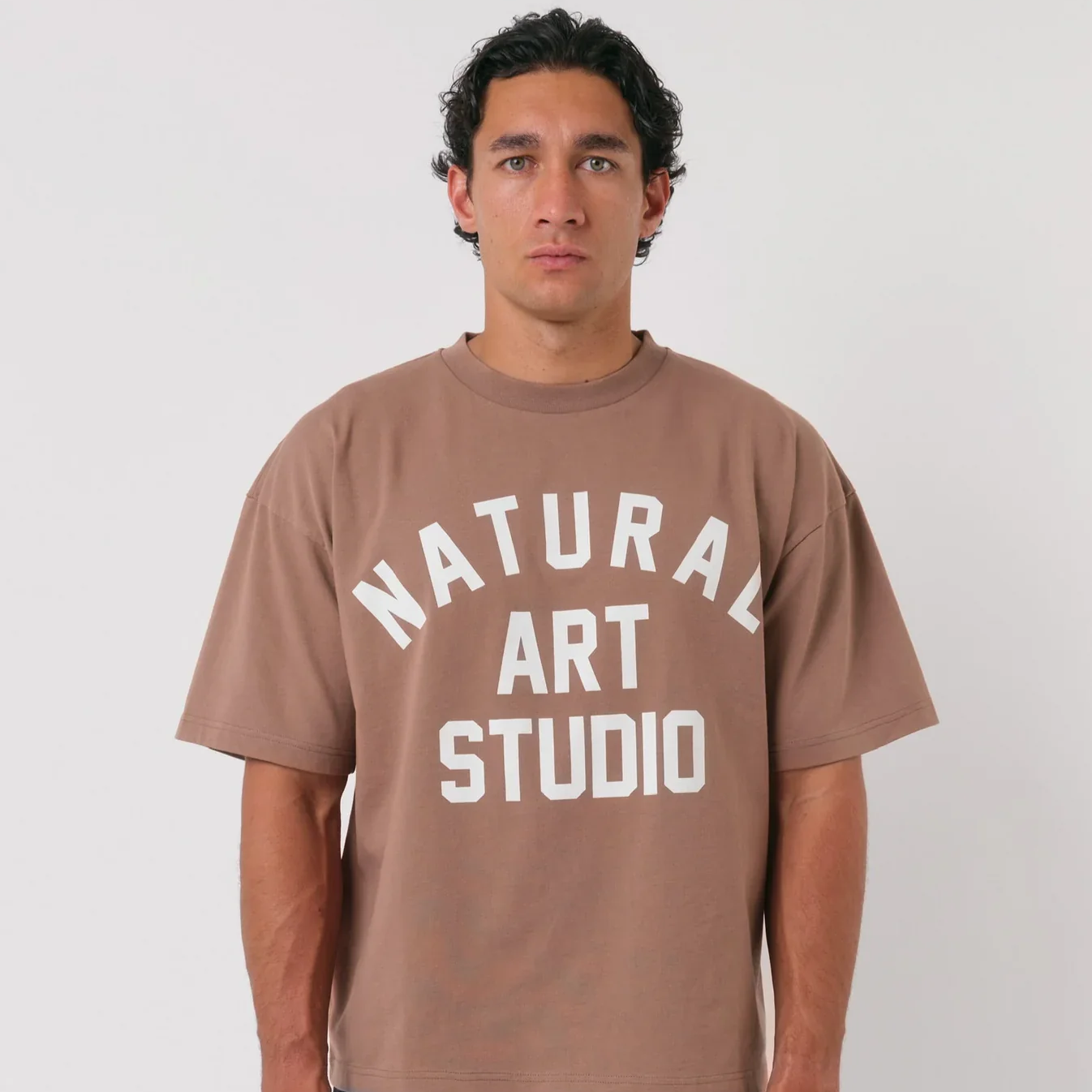 Natural Art Studio Mocha Tee with screen print logo, boxy fit, oversized drop shoulder.