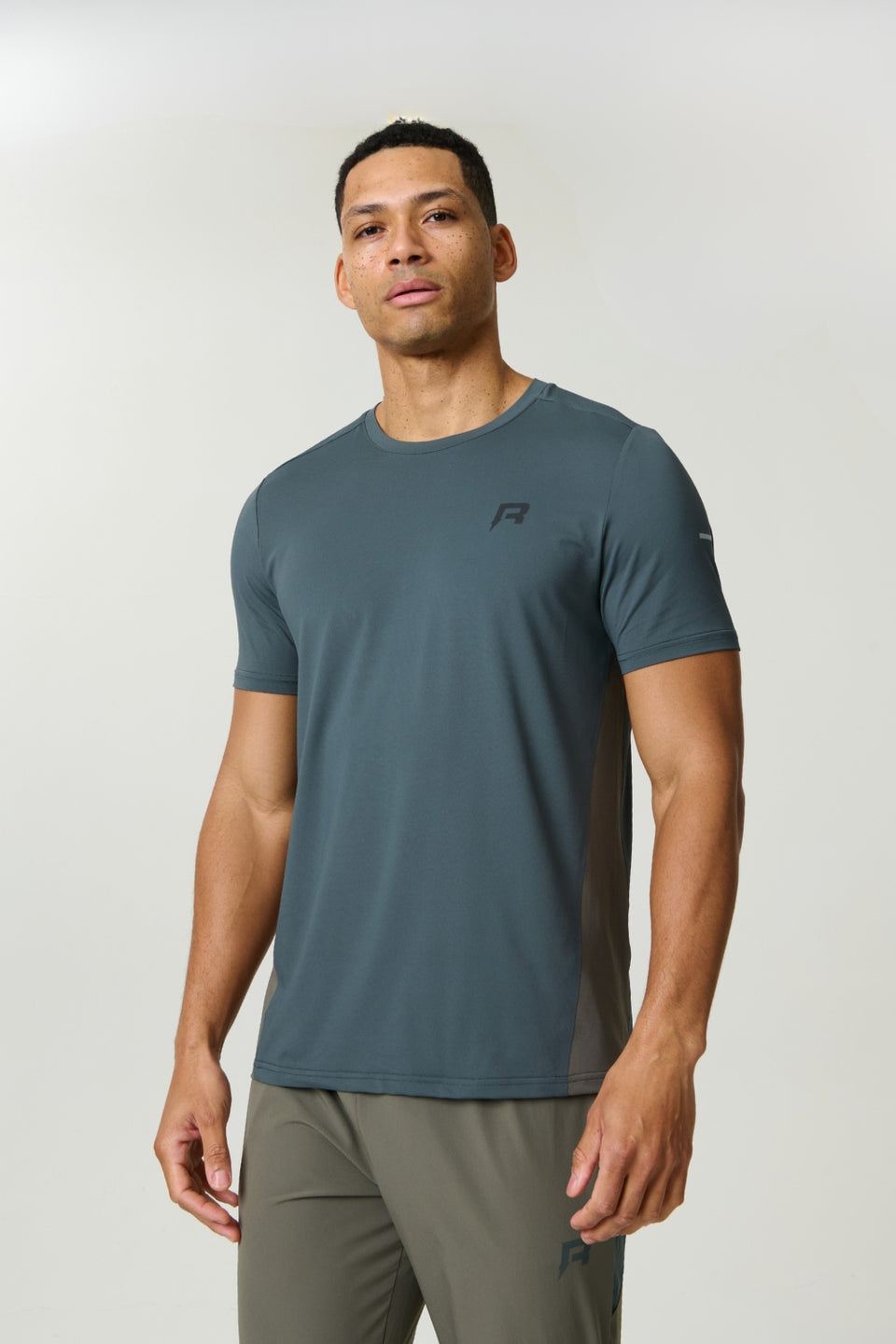 Reprimo Vortex T-Shirt in Dark Moss and Grey Velvet with ergonomic panels and lightweight fabric for athletic performance