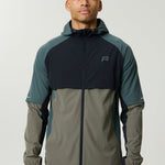 Reprimo Vortex Windbreaker in dark moss and grey velvet with ergonomic design and reflective details