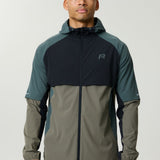 Reprimo Vortex Windbreaker in dark moss and grey velvet with ergonomic design and reflective details