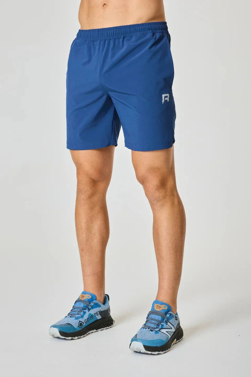 Reprimo Pulse Shorts in Indigo color, worn by a model.