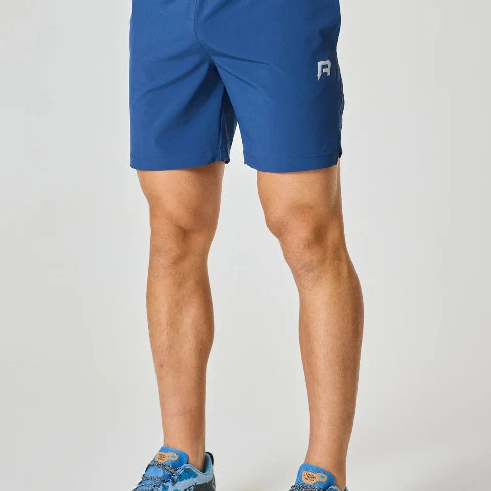 Reprimo Pulse Shorts in Indigo color, worn by a model.