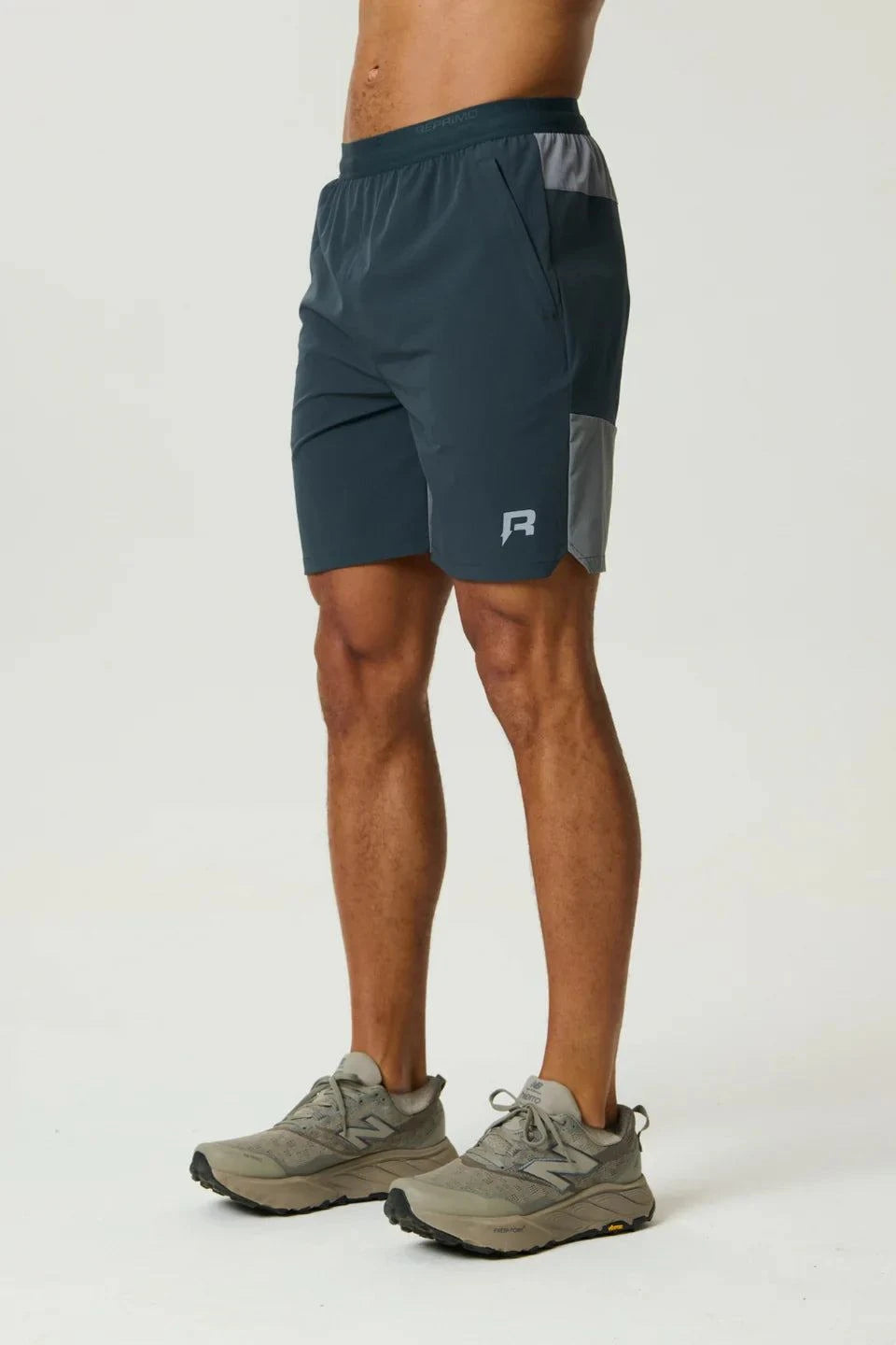 Reprimo Flight Short in Gargoyle Ash Green with breathable fabric and functional zippered pockets for active wear