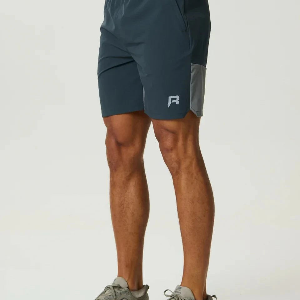 Reprimo Flight Short in Gargoyle Ash Green with breathable fabric and functional zippered pockets for active wear