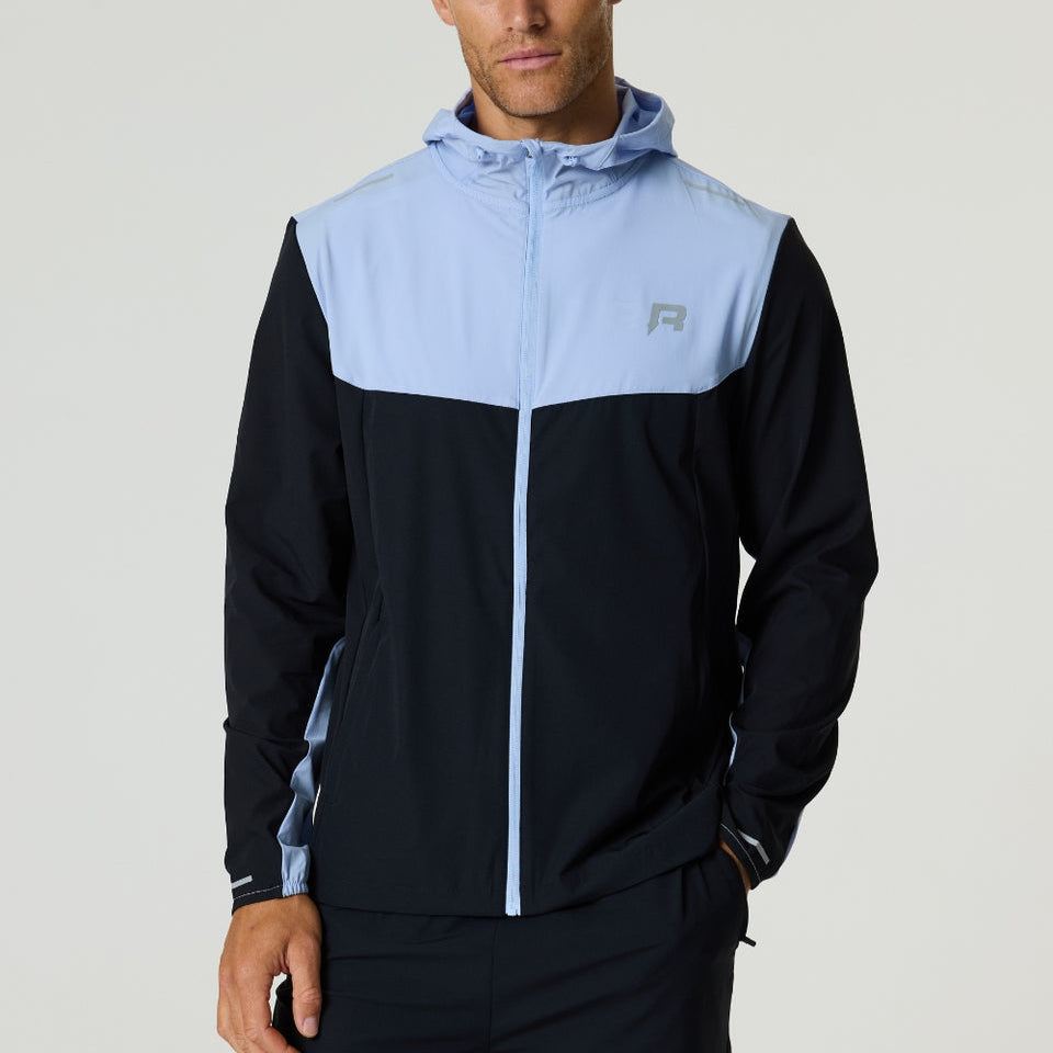Reprimo Flight Windbreaker black and dusky sky color block jacket with hood and zip pockets for lightweight weather protection.