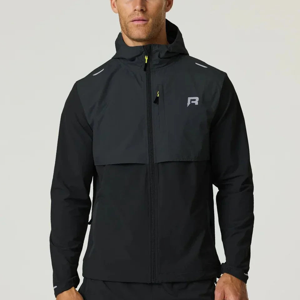 Reprimo Summit black windbreaker jacket with hood and yellow zipper detail worn by male model