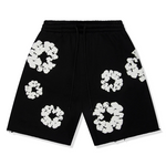 Denim Tears Cotton Wreath Sweatshorts in black and white.