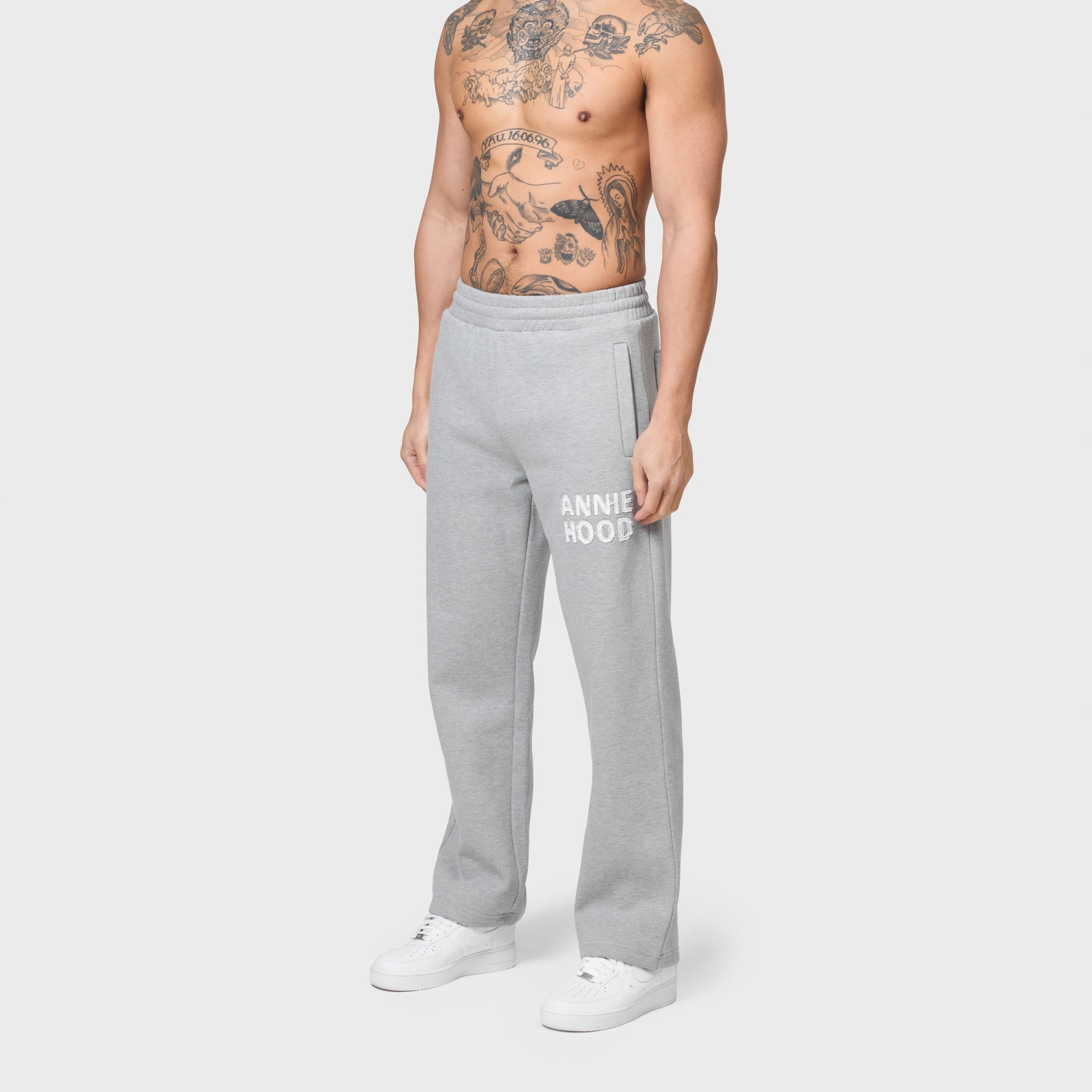 Grey ANNIE HOOD APPLIQUE JOGGERS in 500gsm brushback cotton with relaxed fit worn by a model