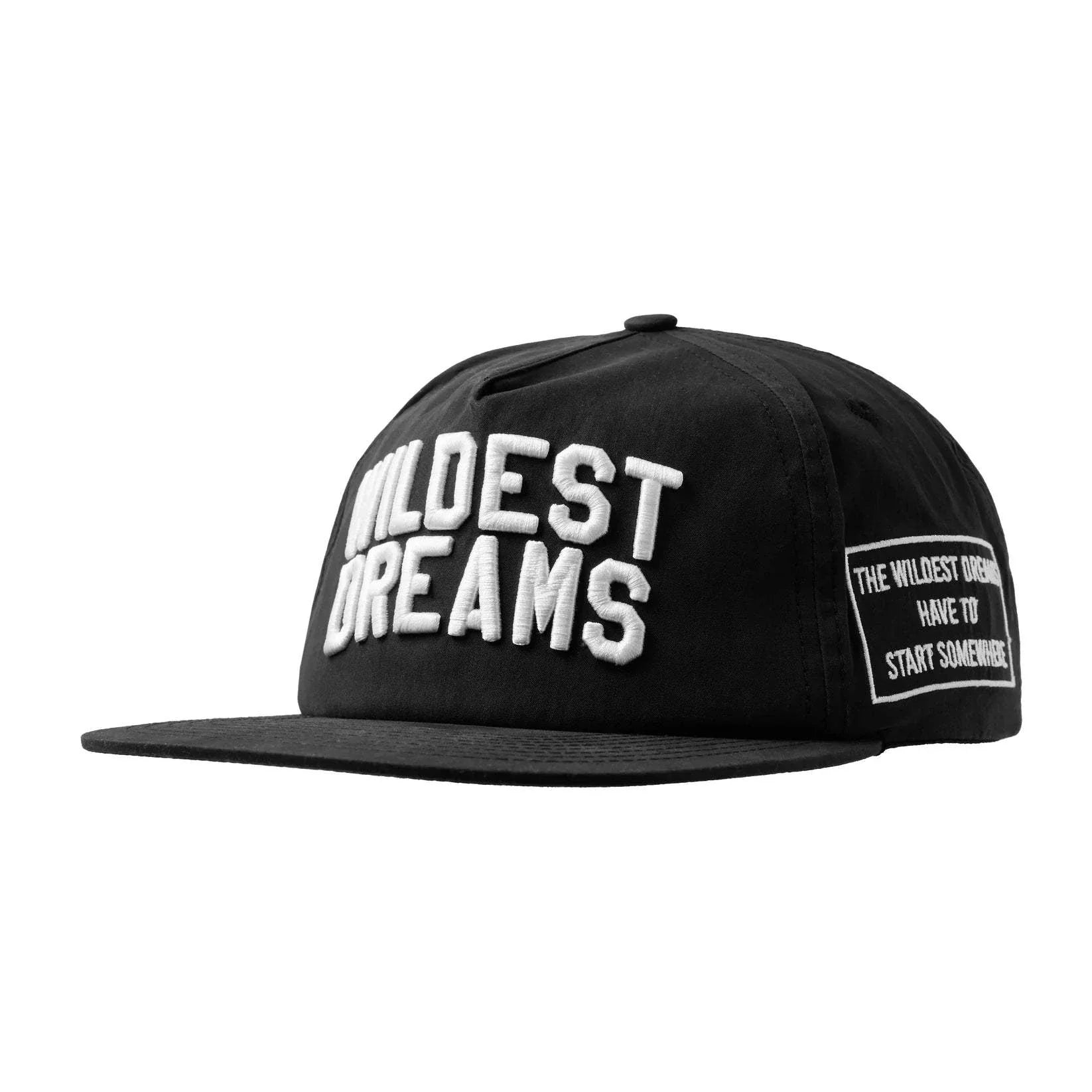 Black and white Wildest Dreams Varsity Cap with bold embroidered lettering and side patch detail
