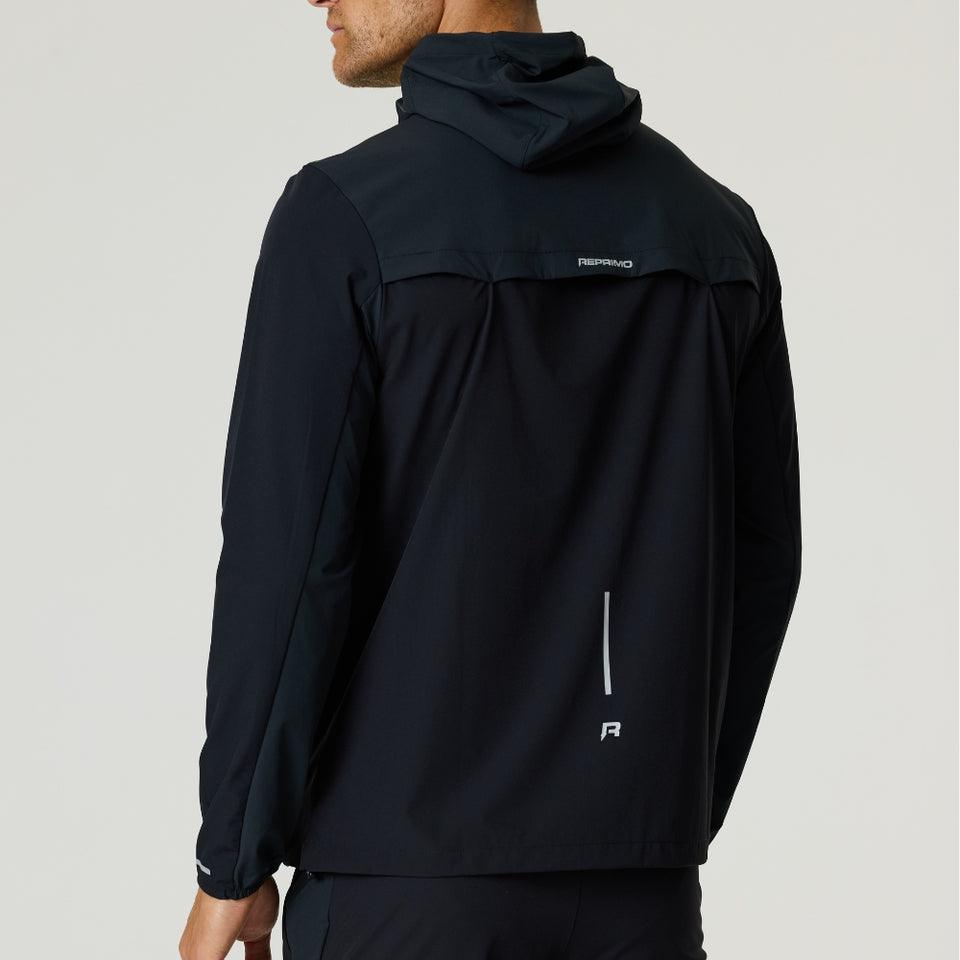 Back view of Reprimo Flight Windbreaker in black and meteorite color made from lightweight polyamide fabric with a hood and zip pockets.