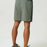 Reprimo Clima Shorts in dark moss and khaki with dual-fabric, breathable panels, and elastic waistband for active performance