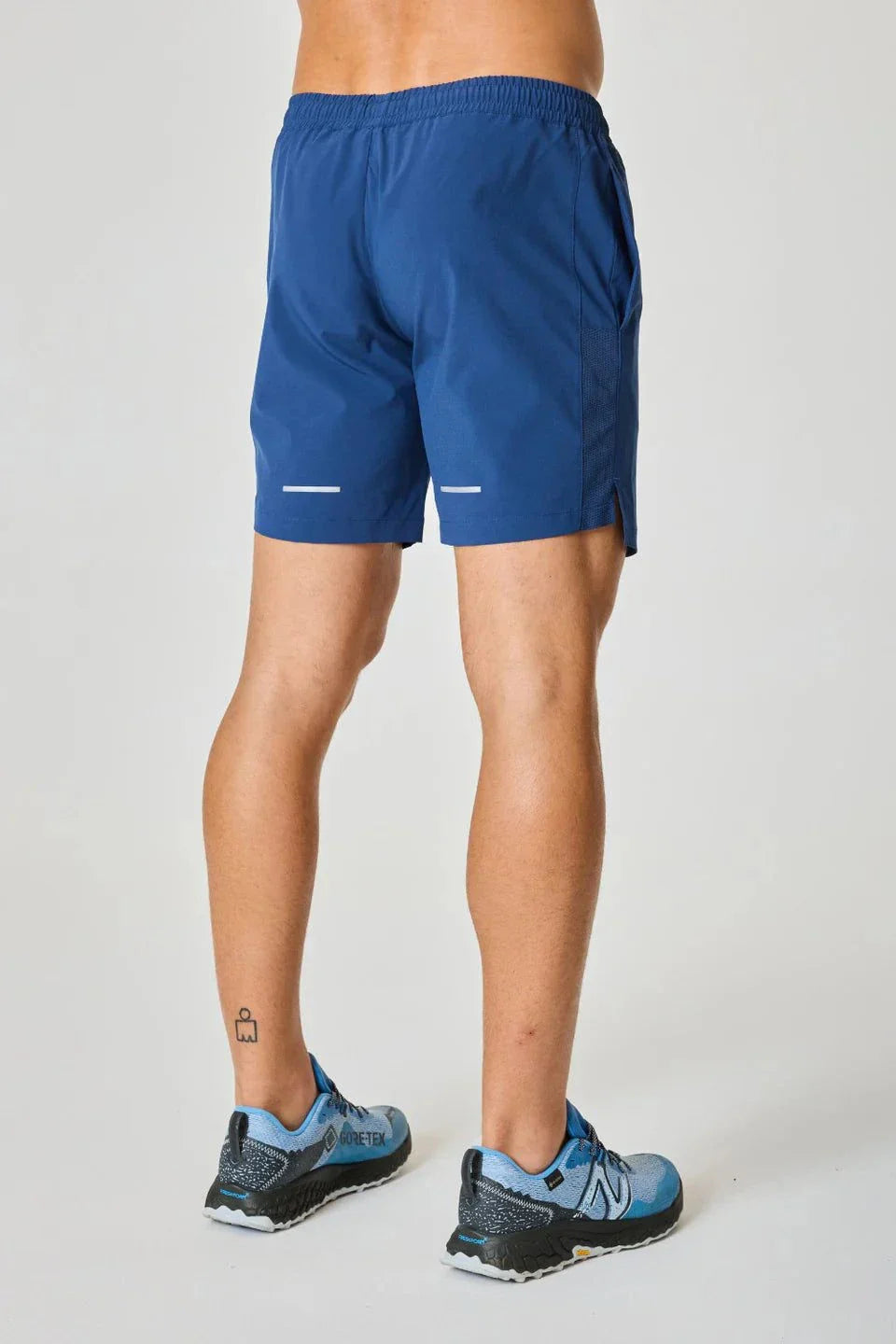 Reprimo Pulse Shorts in Indigo worn by a person.