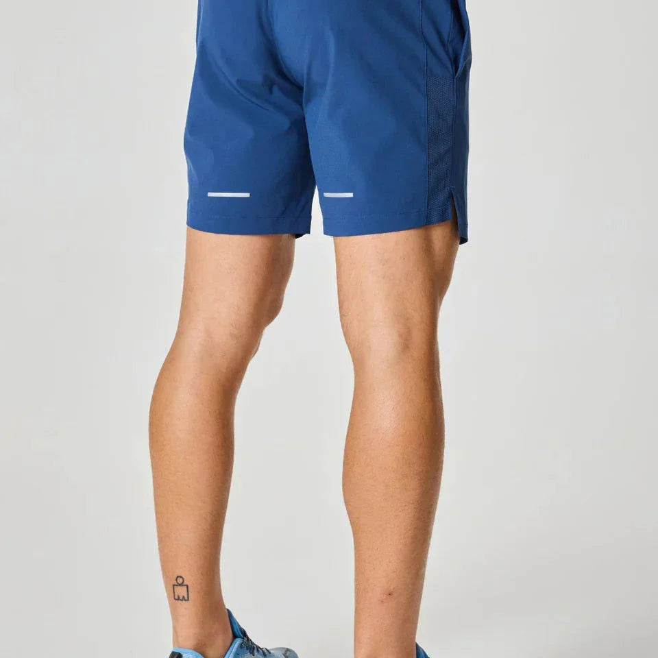 Reprimo Pulse Shorts in Indigo worn by a person.