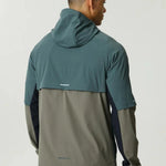 Reprimo Vortex Windbreaker in dark moss and grey velvet with ergonomic panels and reflective details