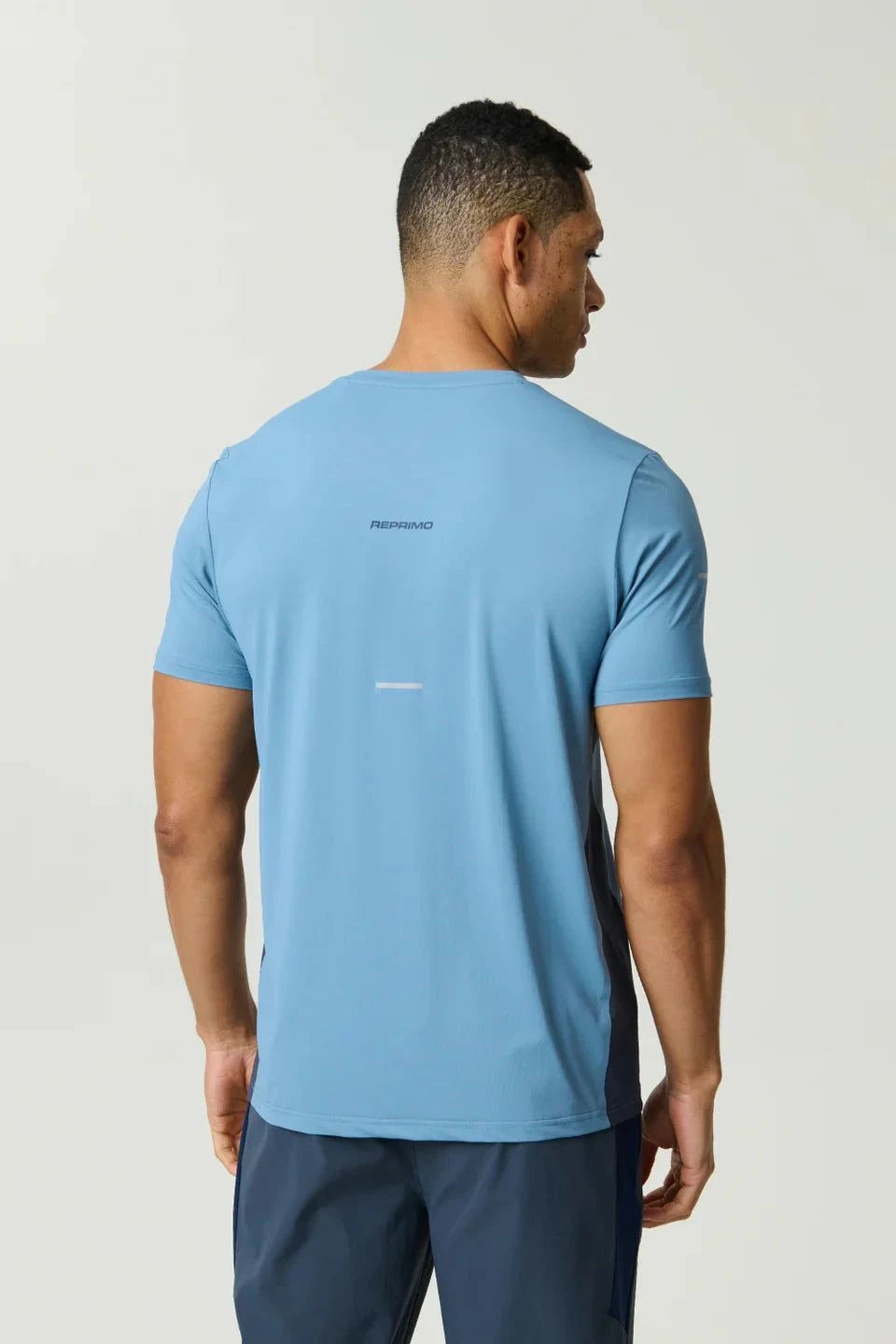 Reprimo Vortex T-Shirt in dusty blue with ergonomic panels and lightweight performance fabric