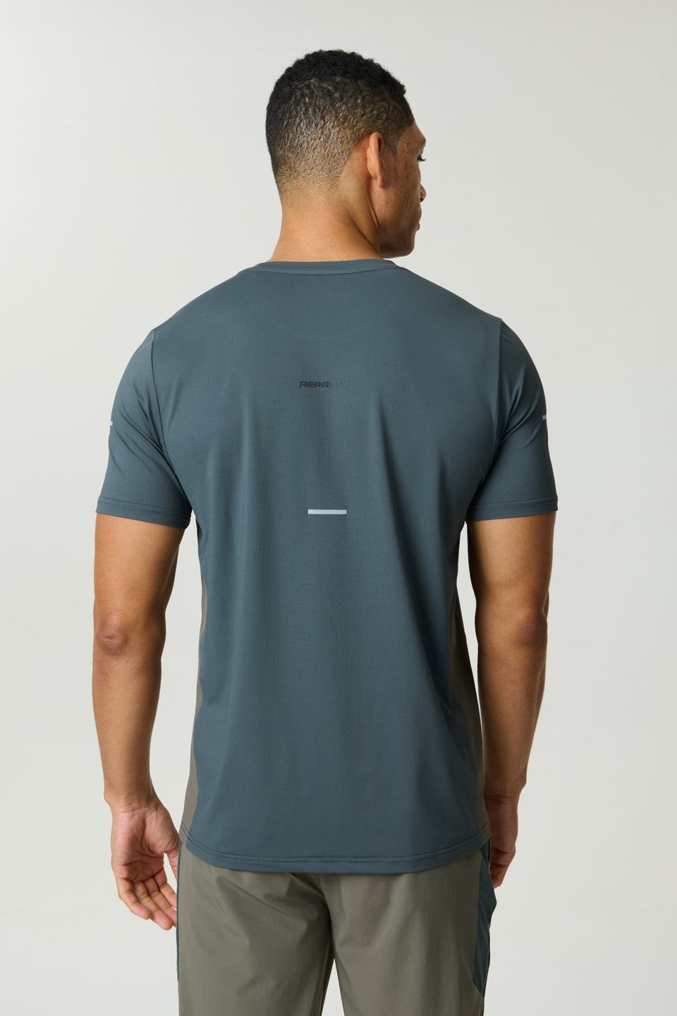 Reprimo Vortex T-Shirt in dark moss and grey velvet with ergonomic panels and lightweight fabric for performance
