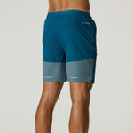 Reprimo Flight Shorts in tidal teal and blue steel with breathable fabric, elastic waistband, and functional side pockets, designed for lightweight performance and freedom of movement.