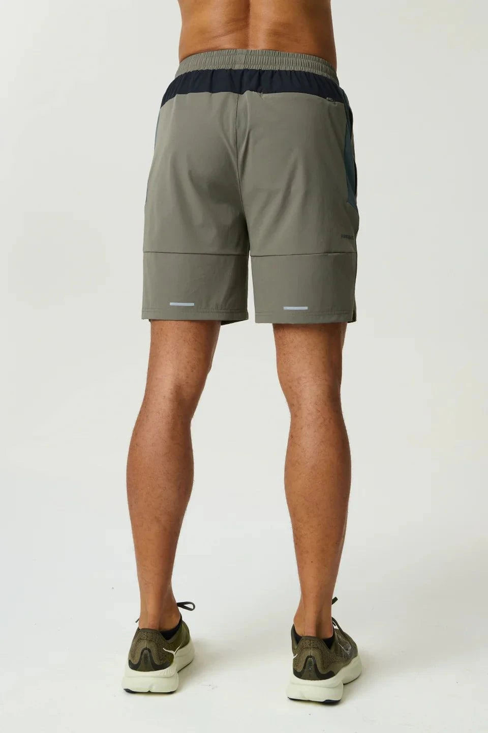 Reprimo Vortex Shorts in dark moss and grey velvet with ergonomic panels and adjustable waistband for flexible, technical performance