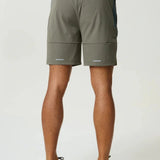 Reprimo Vortex Shorts in dark moss and grey velvet with ergonomic panels and adjustable waistband for flexible, technical performance