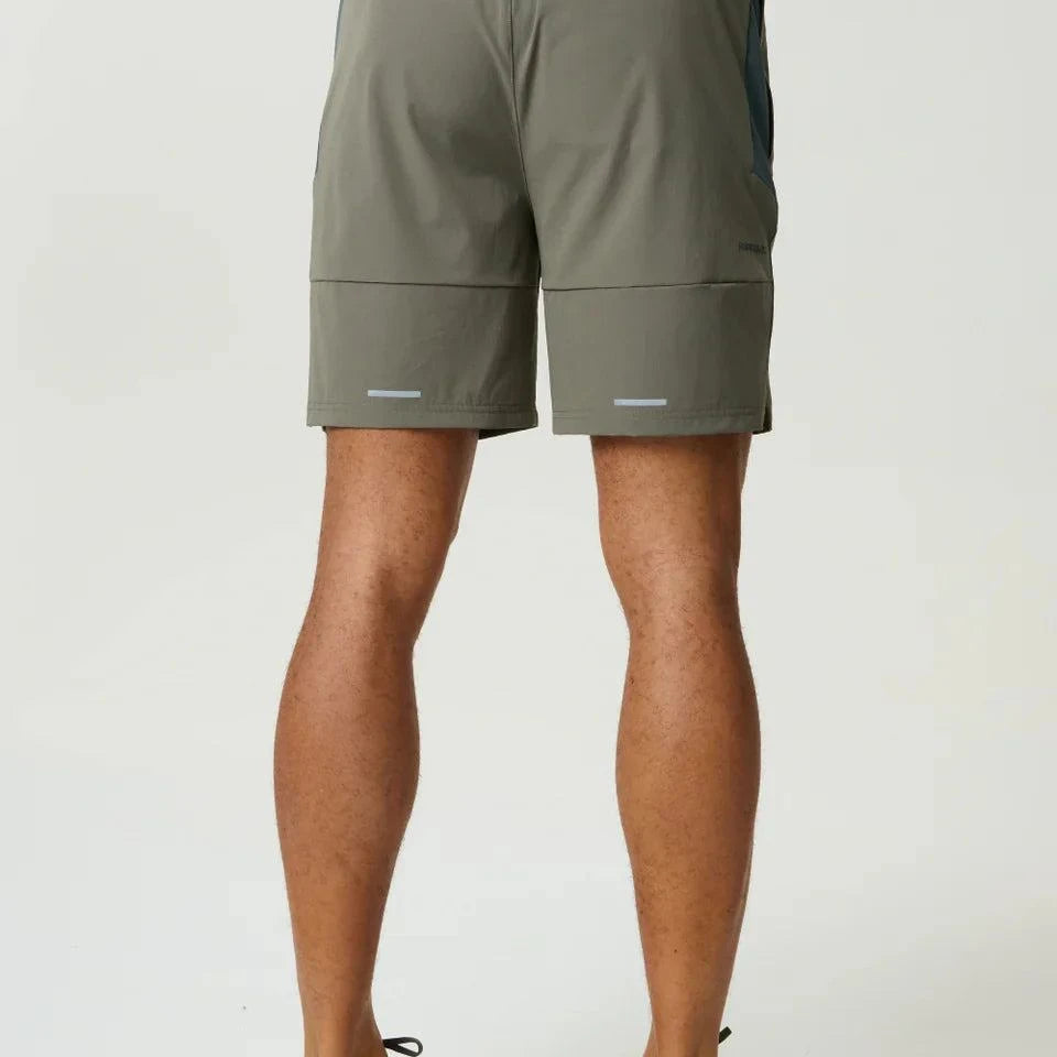 Reprimo Vortex Shorts in dark moss and grey velvet with ergonomic panels and adjustable waistband for flexible, technical performance